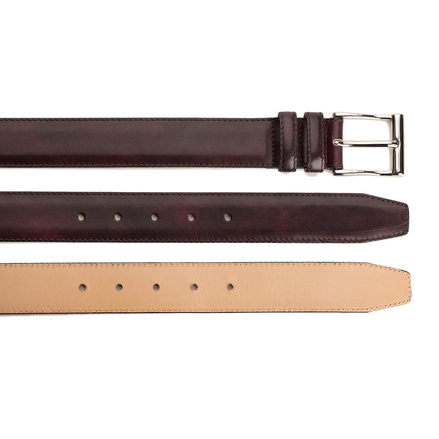 Meermin plum museum calf belt, three views showing buckle end, hole punches, and tan leather lining underside