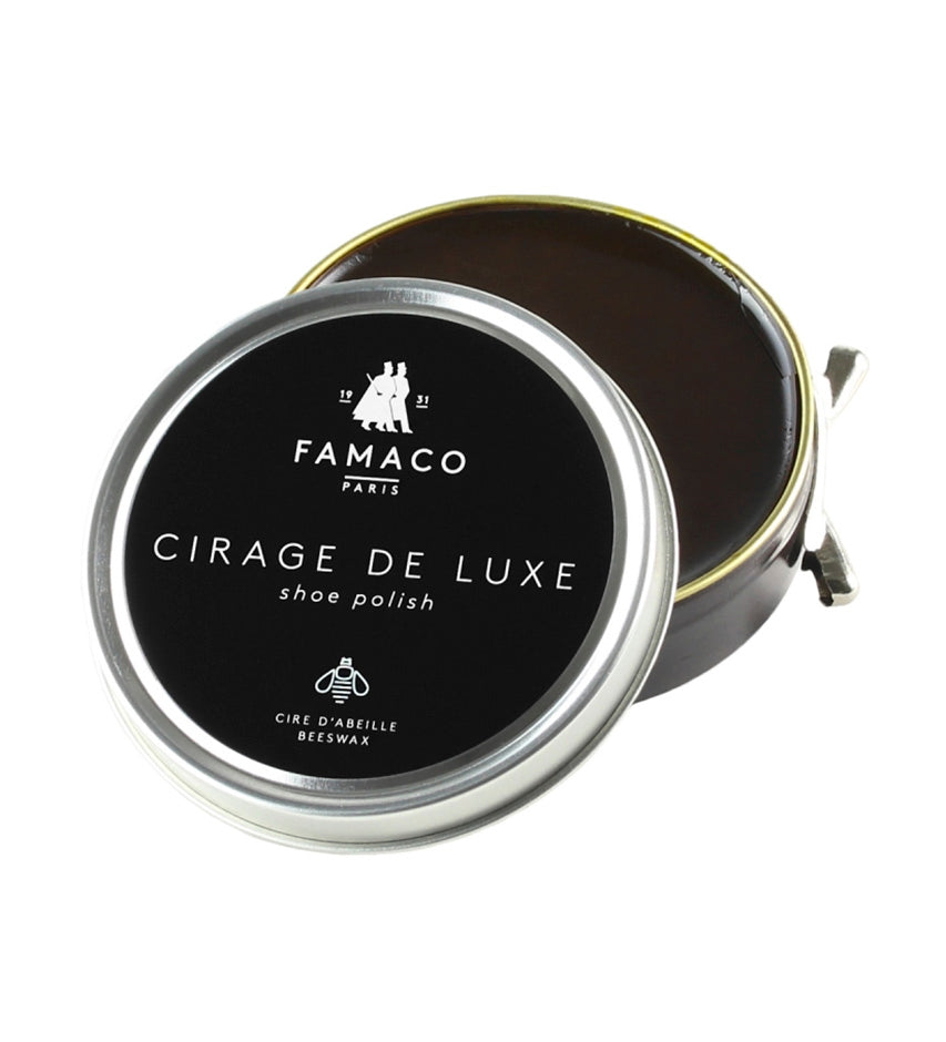 Famaco Cirage de Luxe tin, lid propped open beside base, showing dark brown beeswax polish and branded label