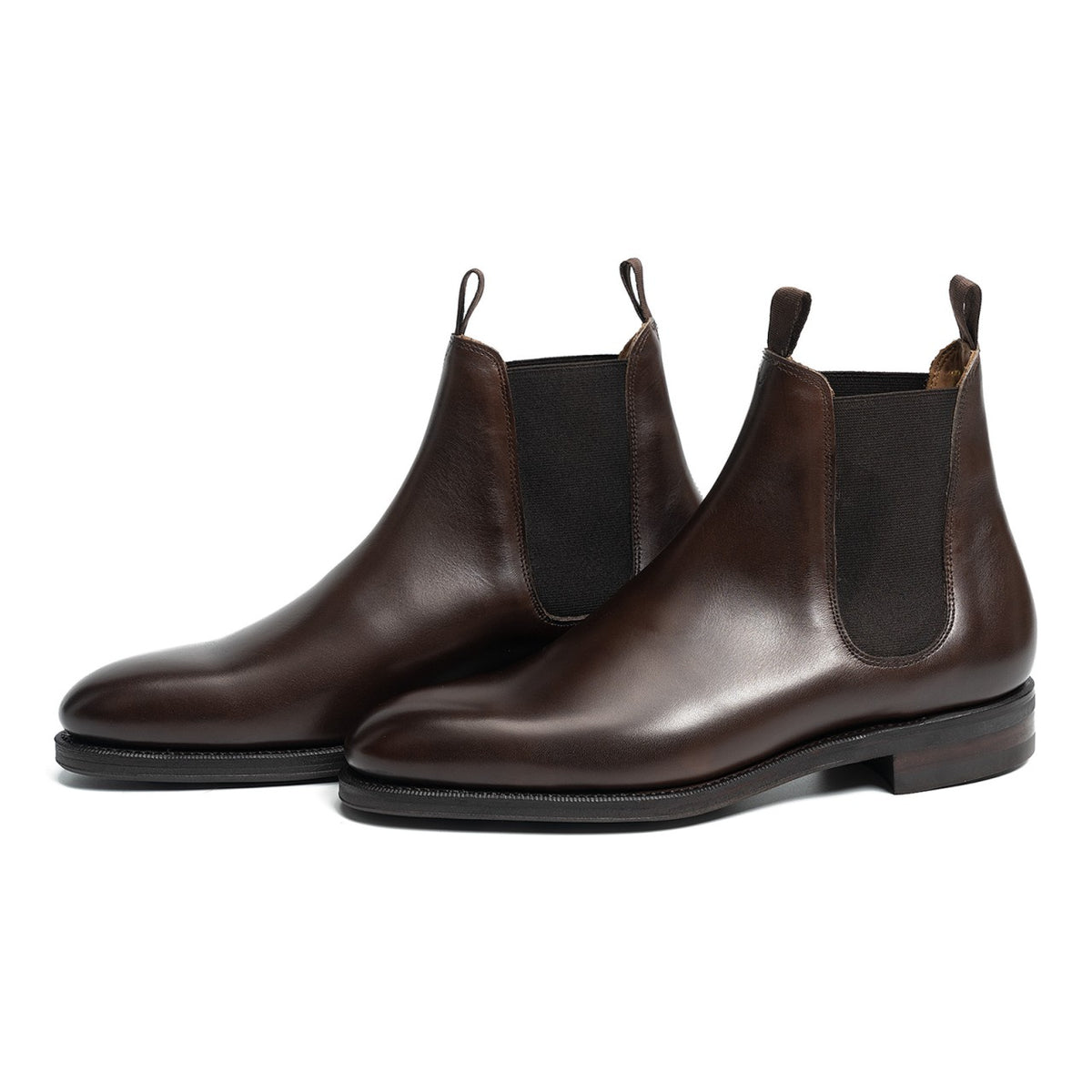 Meermin dark brown calfskin wholecut Chelsea boots, pair shown at three-quarter angle with elastic side panels visible