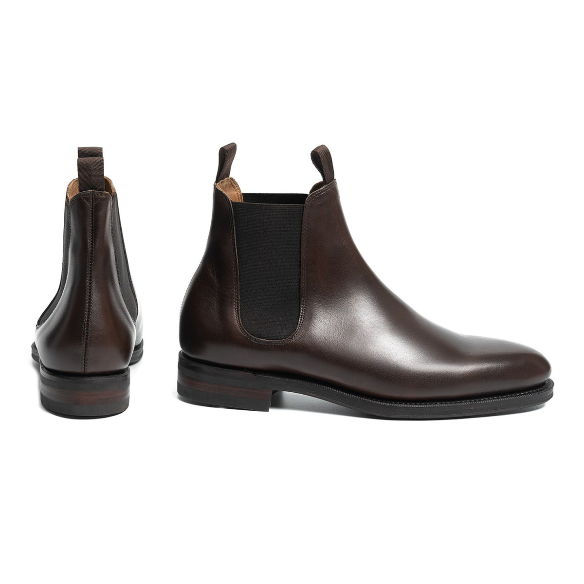 Meermin dark brown calf Chelsea boot, paired side profile and rear heel views showing elastic gussets and stacked leather sole