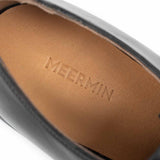 Close-up of the beige full grain calf insole with embossed Meermin branding, showing texture of the memory foam-backed leather