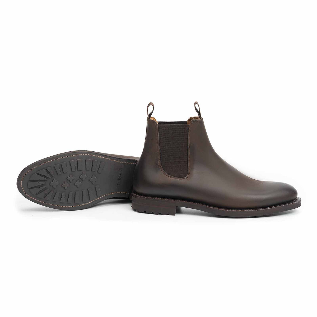 Meermin brown waxy calf Chelsea boot, side profile paired with matching sole facing up, showing lug outsole tread