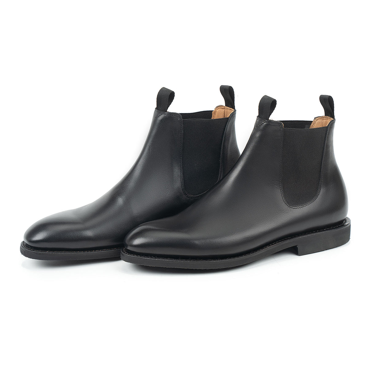 Meermin black silkcalf Chelsea boots, front three-quarter view showing wholecut uppers, elastic side panels, and diamond latex soles