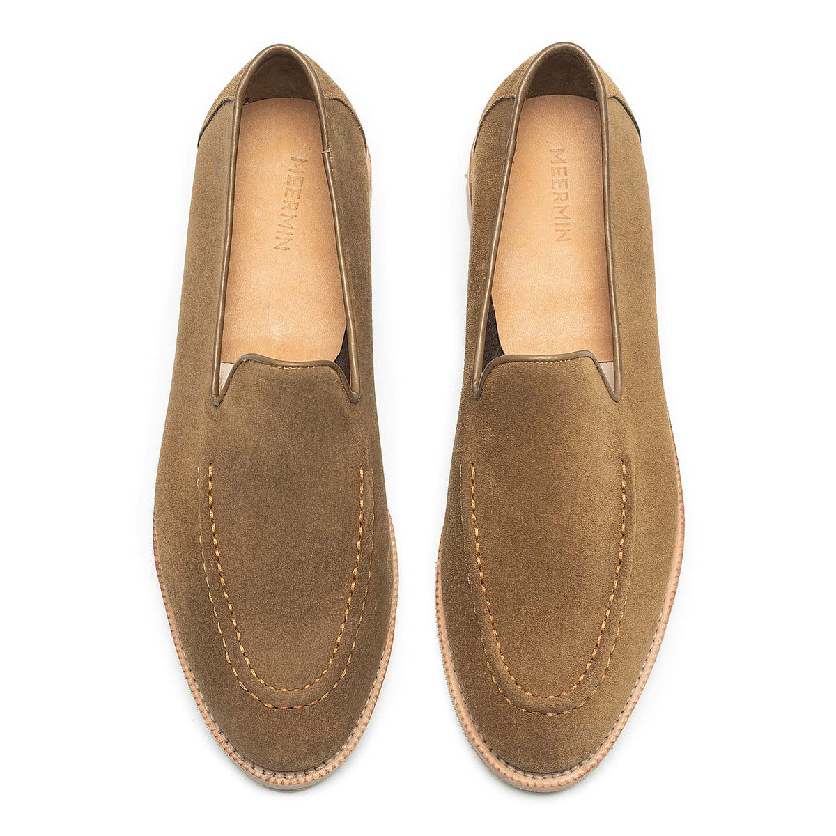 Meermin Atacama suede unlined loafers, top-down view of both shoes showing hand-sewn apron stitching and tan leather insoles