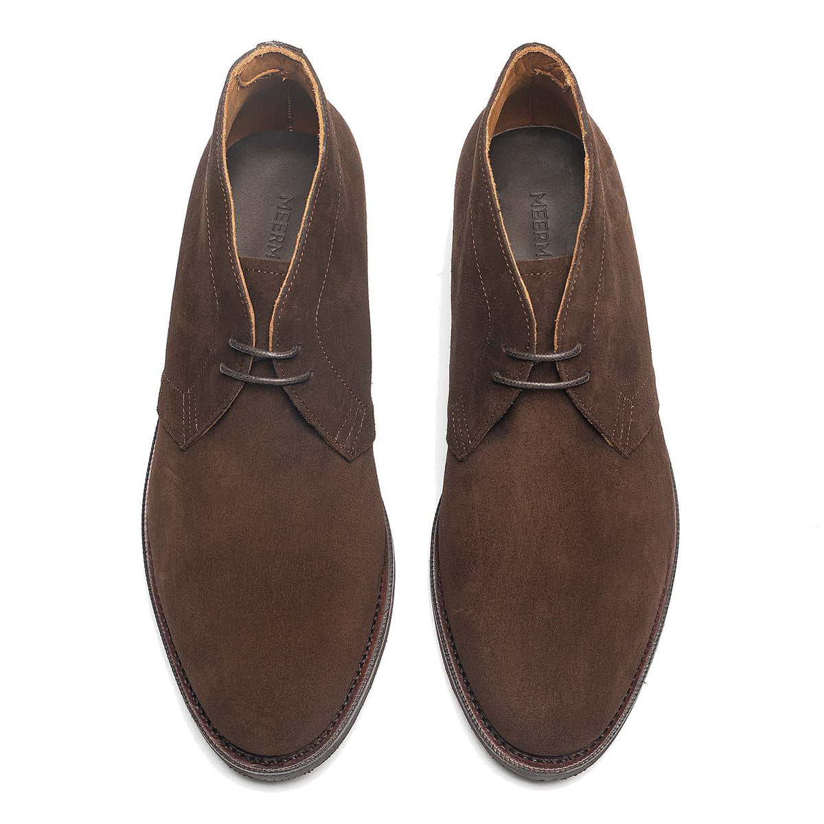 Meermin brown suede chukka boots, top-down view of both pairs showing lace-up vamp and rounded toe shape