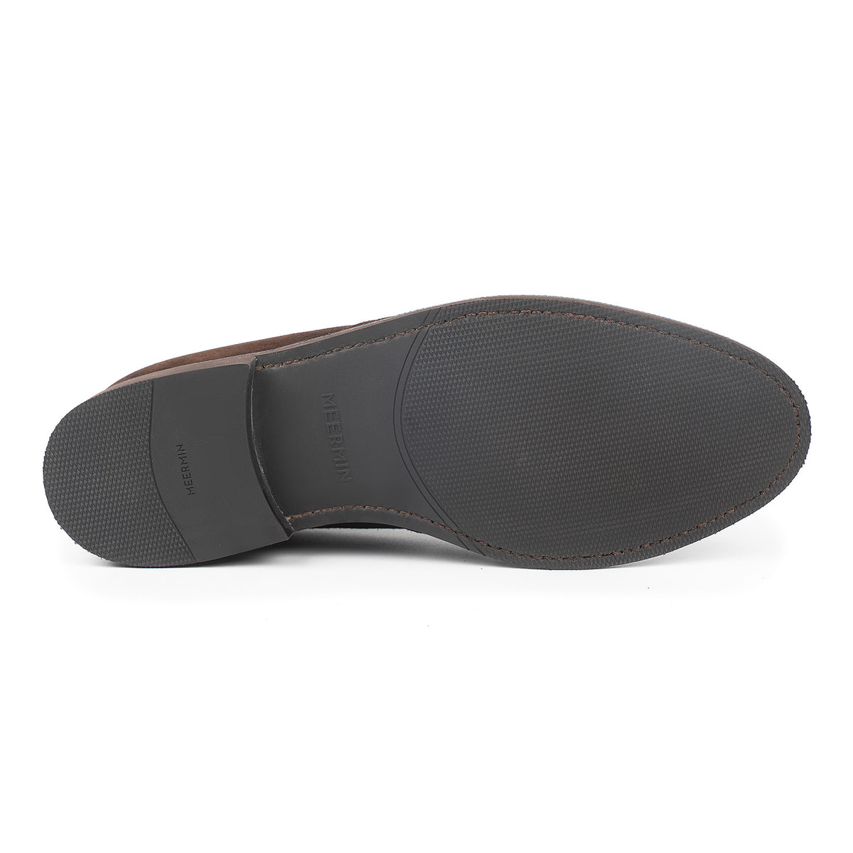 Sole view of Meermin brown suede chukka boot, showing textured diamond latex rubber outsole and flex Goodyear welted edge