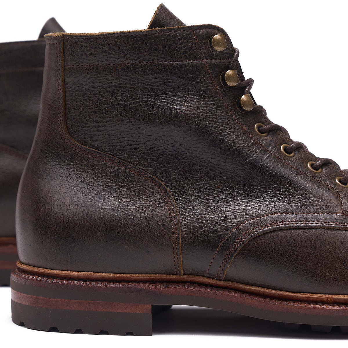 Meermin Caper Green Naked Kudu boot, close-up on heel and lace panel showing grained leather texture and brass eyelets
